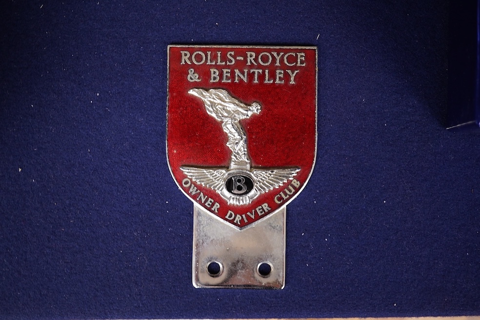 A Rolls Royce and Bentley Owner Driver Club chrome and enamel car radiator badge, 10.7 x 6.6cm. Condition - fair to good.